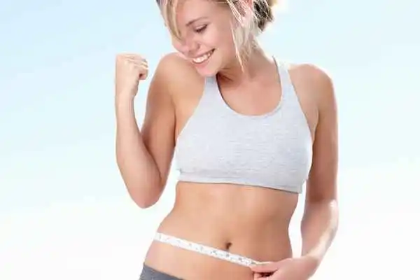 woman happy after fat reduction treatment Henley-In-Arden