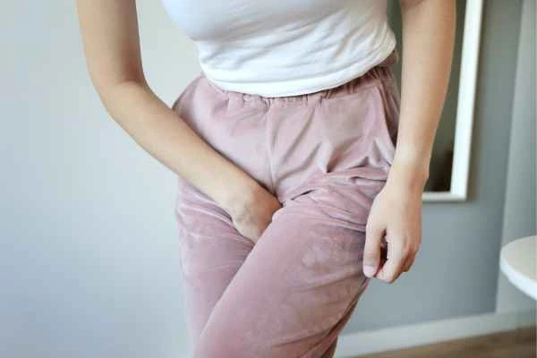 older woman running to the toilet because of urinary incontinence Henley-In-Arden