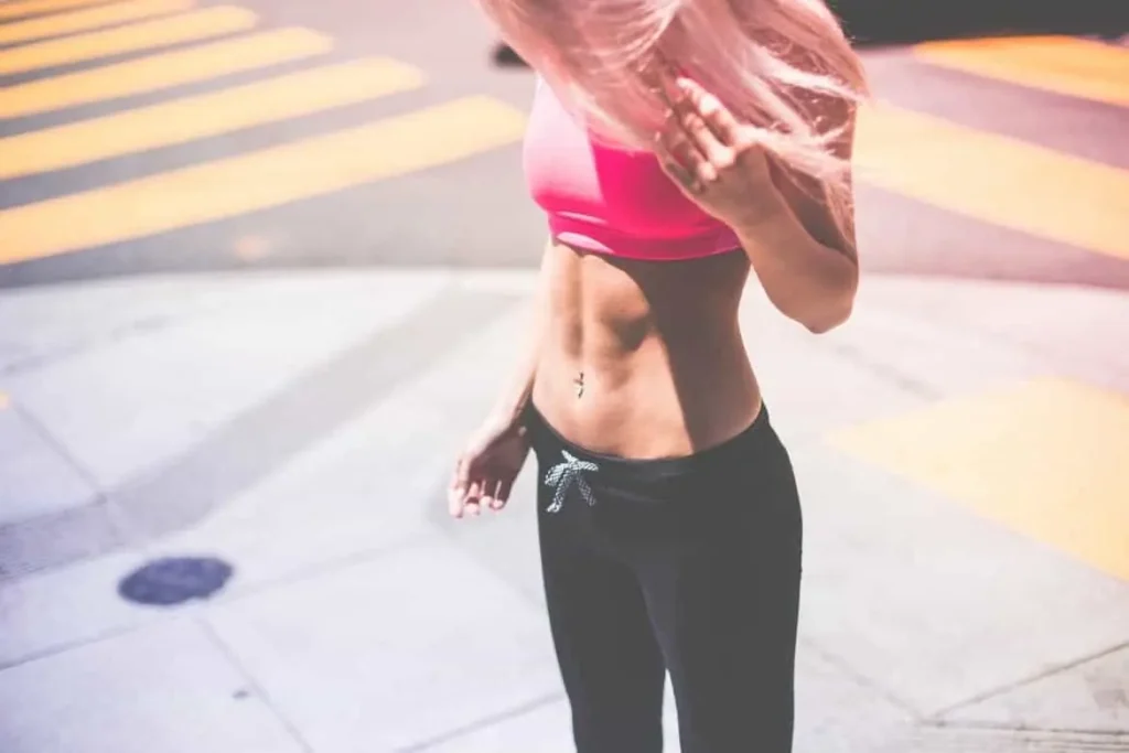 Woman with toned stomach after LA-EMS Body Sculpting Treatment Henley-In-Arden 
